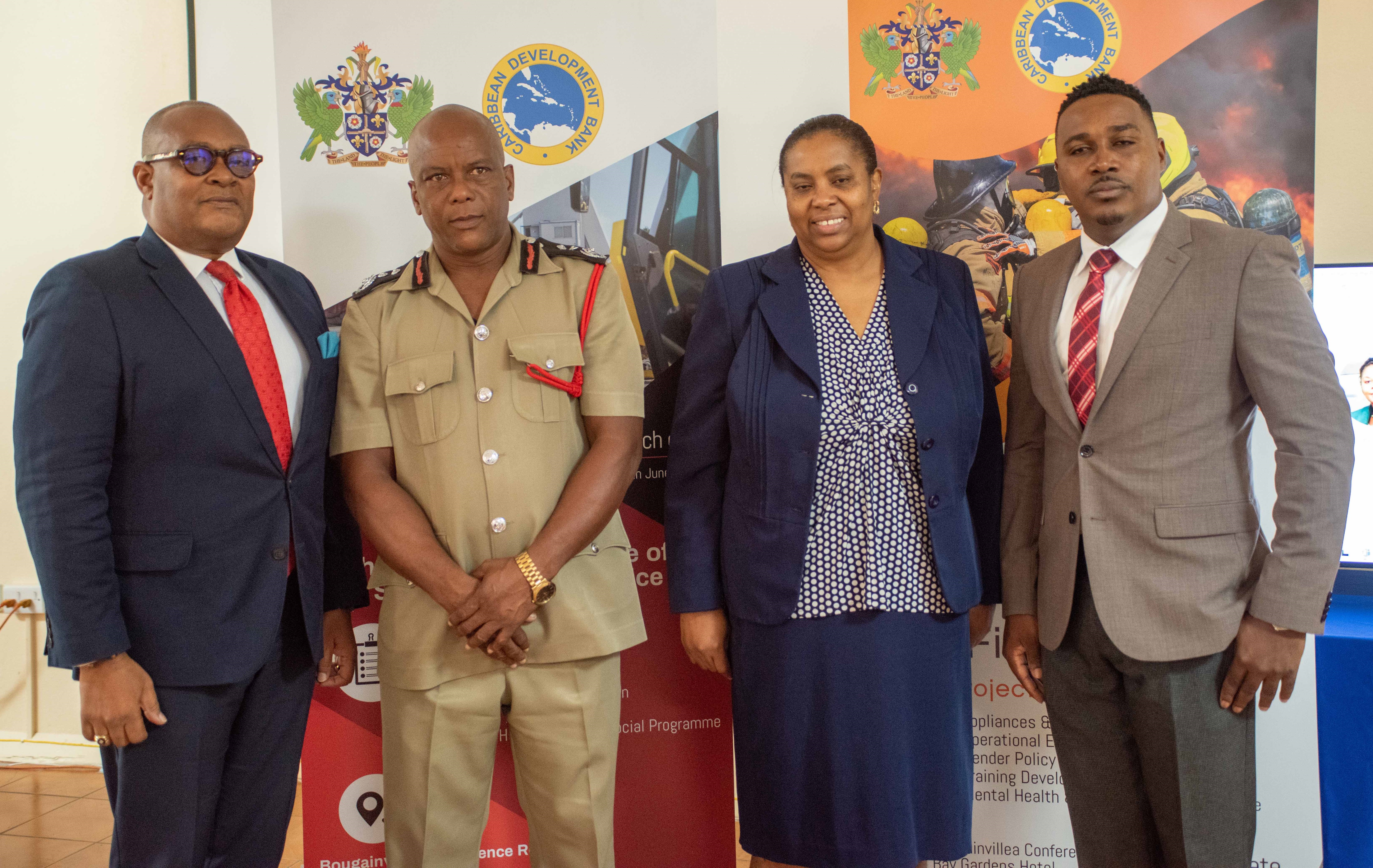 Elbert Ellis Saint Lucia's Chief Fire Officer and two other Government officials standing 