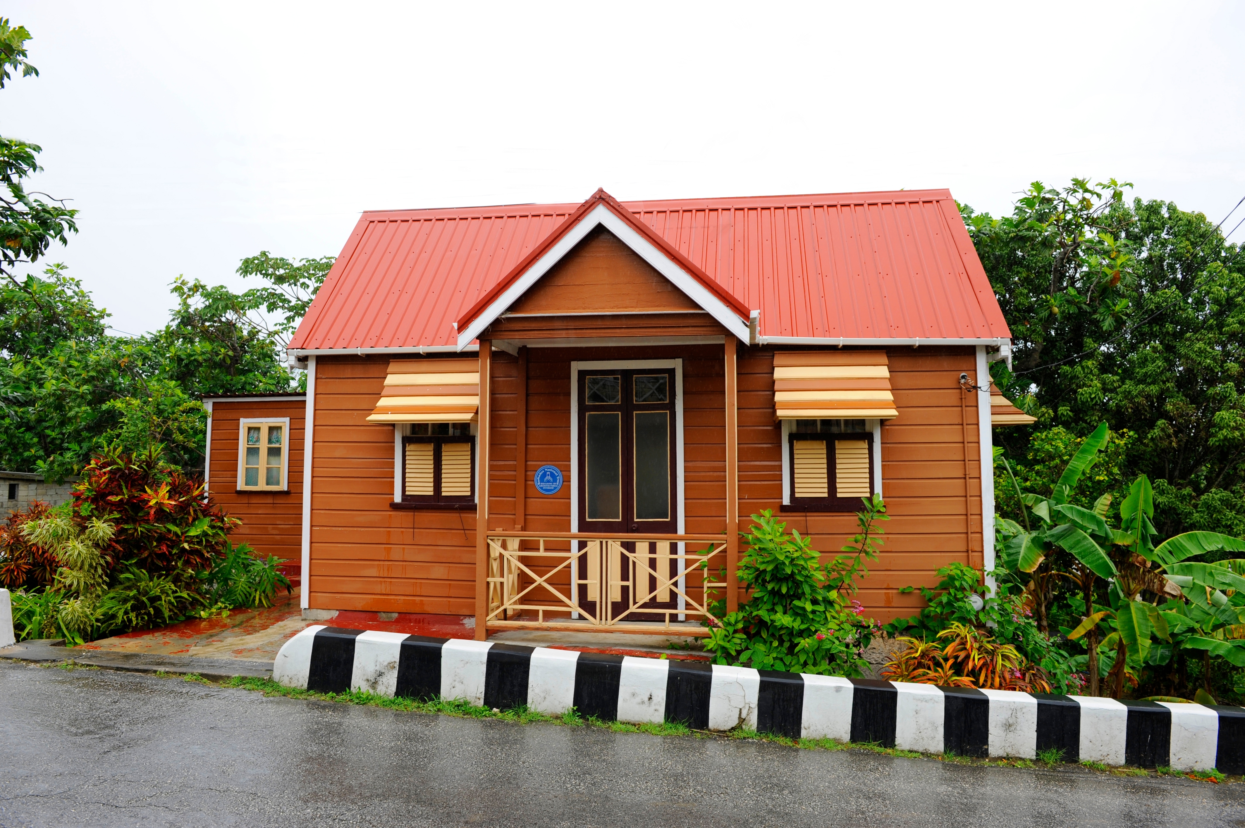 Orange chattel house in Barbados