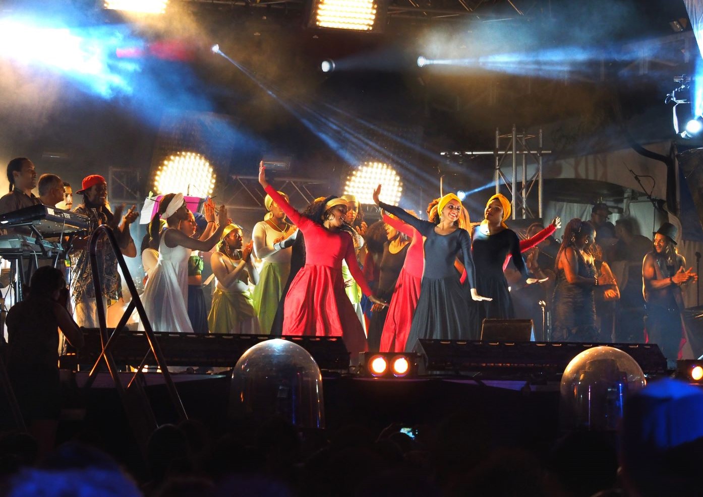 Haitian dancers on stage performing in front of audience