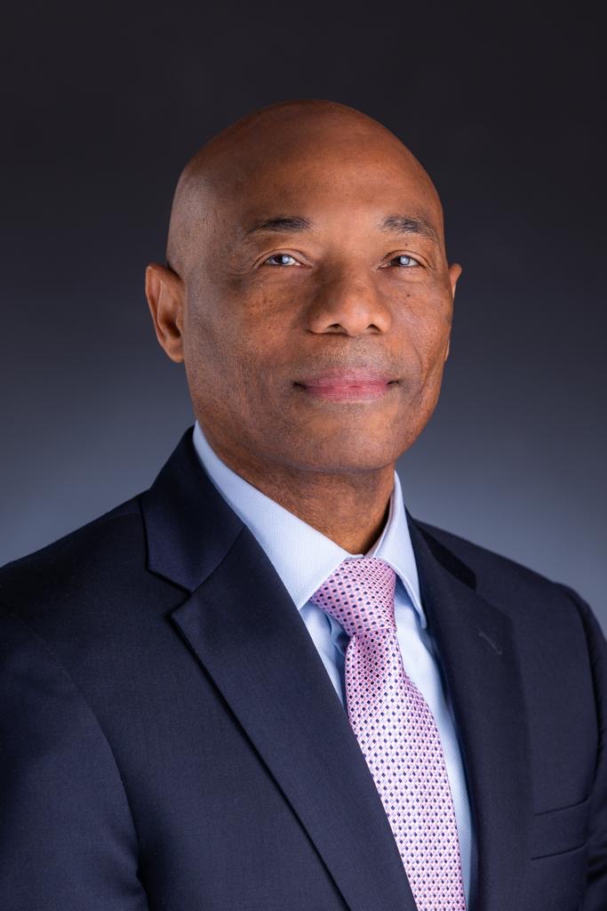 CDB President-elect Dr Gene Leon in charcoal suit, with pink tie with white shirt