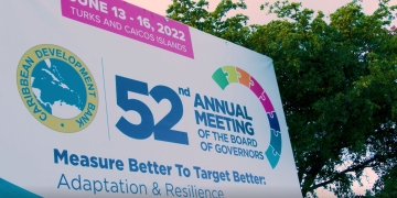 annual meeting billboard along roadway in TCI