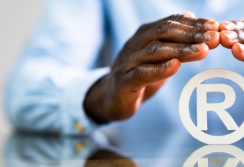 male hands in long sleeved light blue shirt