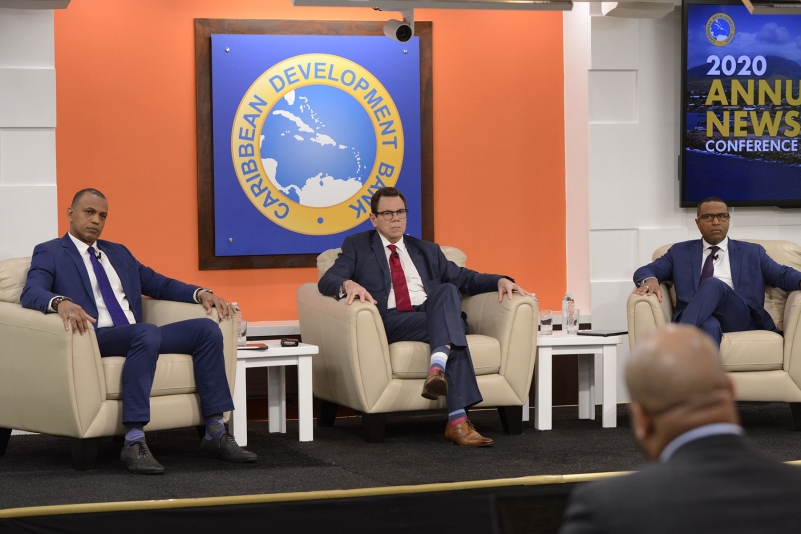 (L-R) Daniel Best, Dr. Warren Smith and Dr. Justin Ram seated in cream soft chairs responding to media queries